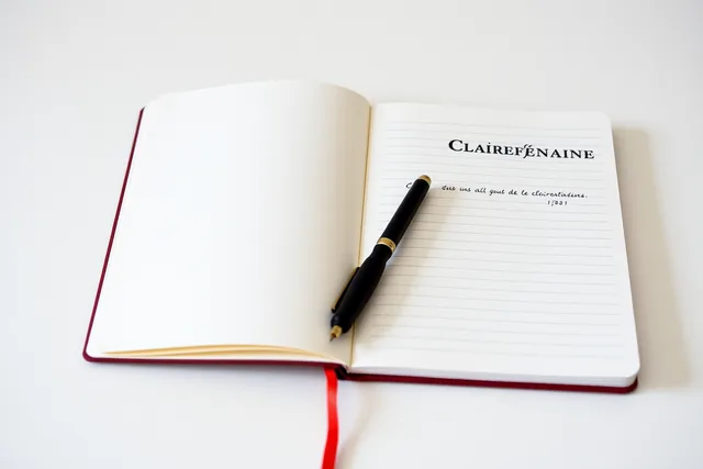 French-language Clairefontaine notebook open with fountain pen on smooth paper. French-language stationery in Quebec, from notebook brands to OQLF labelling rules